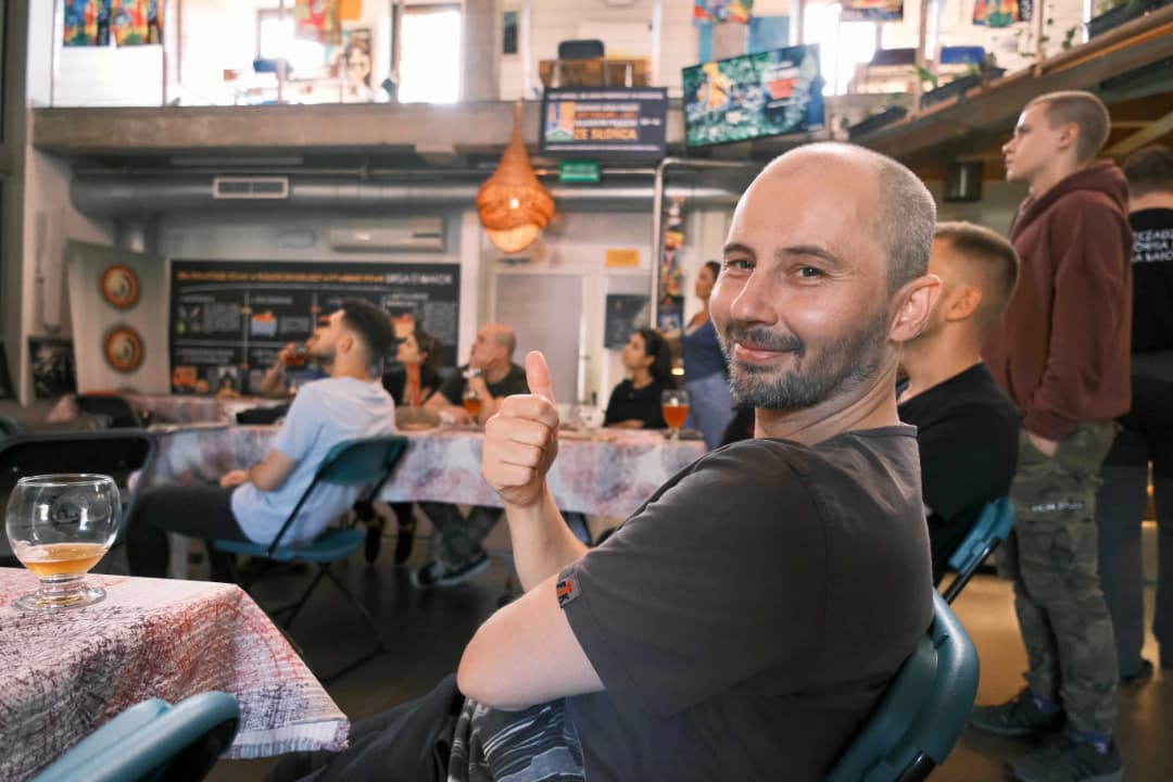 Naturaily employee making a thumbs-up while sitting at the table